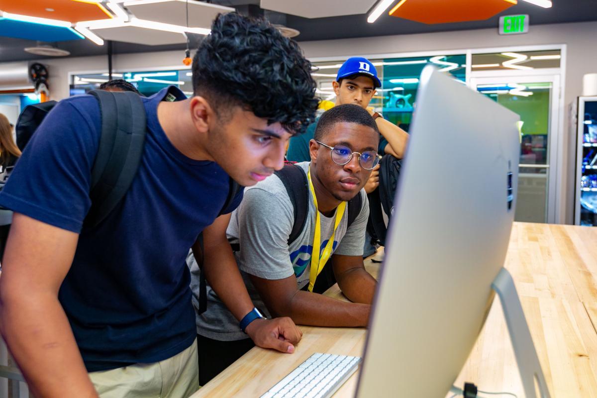 students looking at computer screen